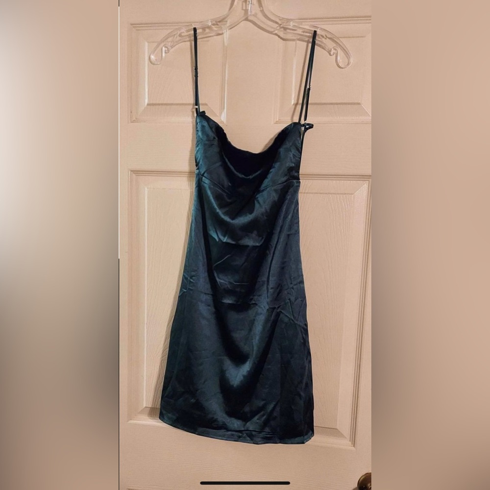 one small and one medium green slip dress